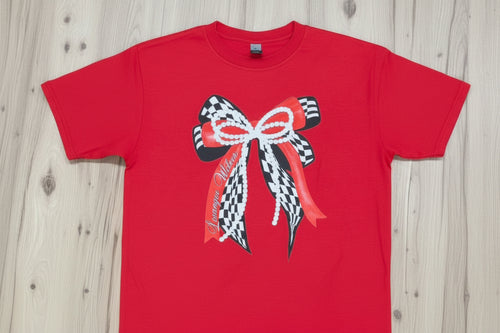 checkered bow with pearl and red bows on top on a red shirt