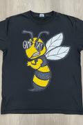 T-shirt arranged on a wood floor. The shirt features yellow and black graphics related to 'Jackets Game Day' and a bee design