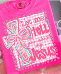 A bright pink short-sleeve t-shirt featuring a graphic design with the text 'Let me tell you about my Jesus' in stylized lettering, alongside a large decorative bow illustration on a pink-and-white gingham background.