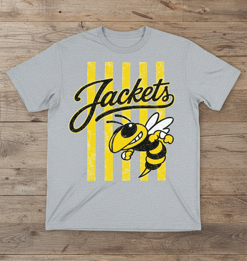 T-shirt arranged on a wood floor. The shirt features yellow and black graphics related to 'Jackets' and a bee design