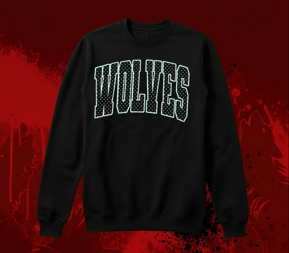 a black sweatshirt with Wolves or any mascot outlined in white with white polka dots inside on a black background