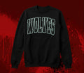 a black sweatshirt with Wolves or any mascot outlined in white with white polka dots inside on a black background